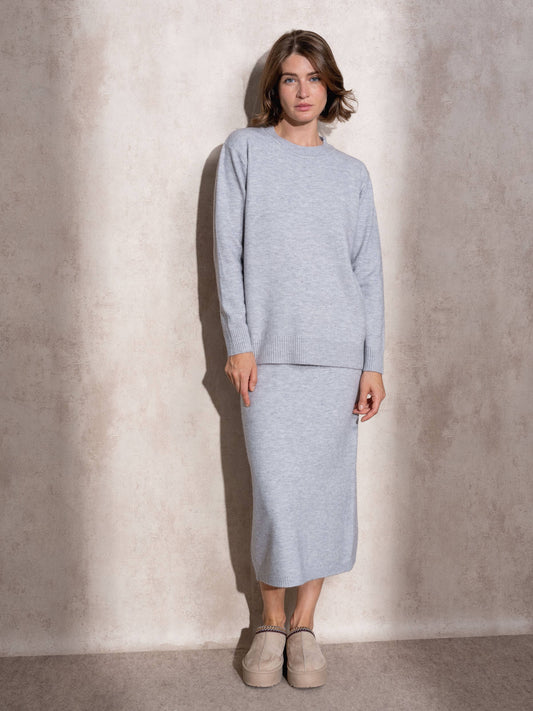 Completo in maglia scintillante due pezzi con gonna midi