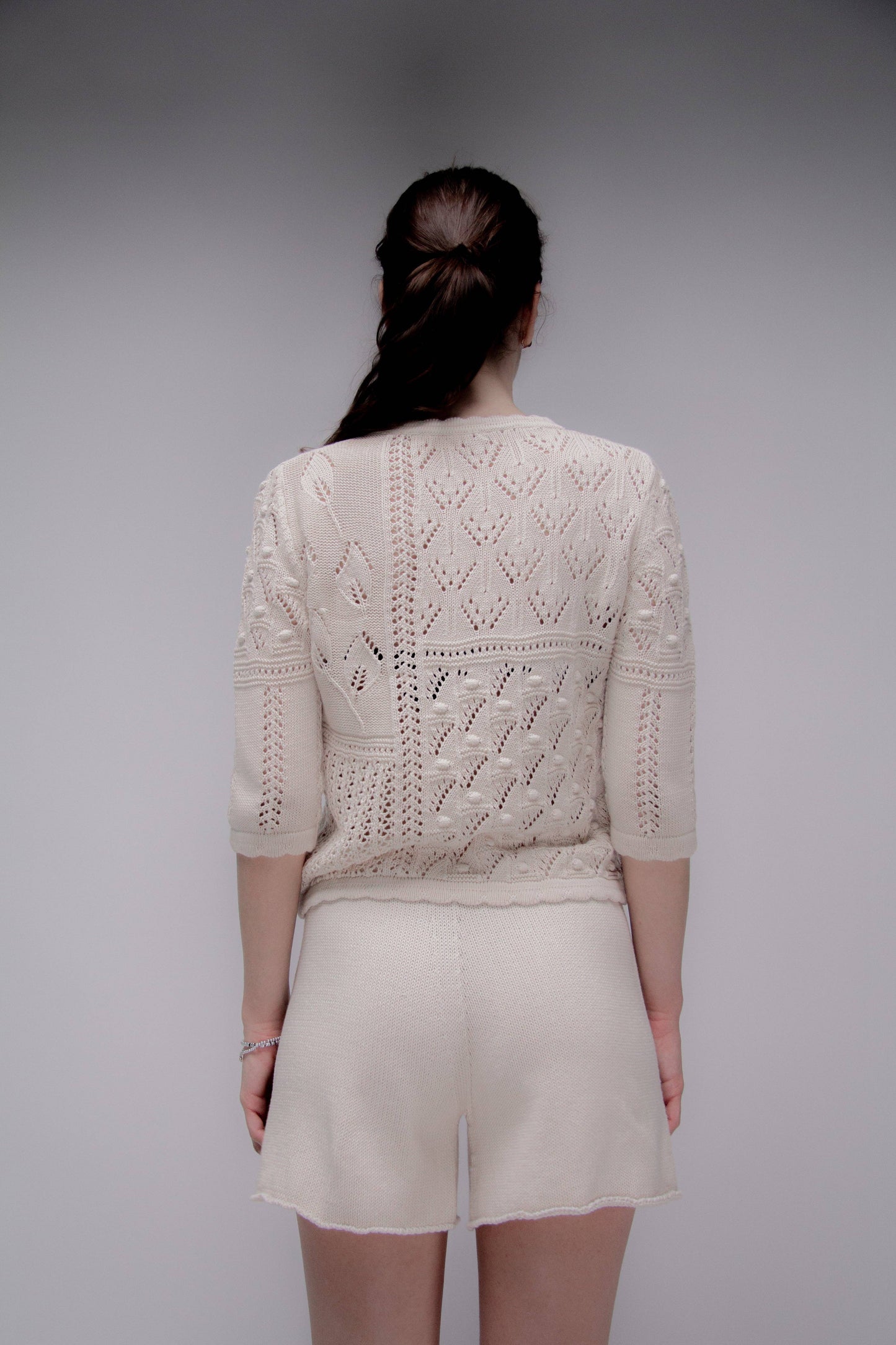 Maglia traforata in cotone con motivo floreale
