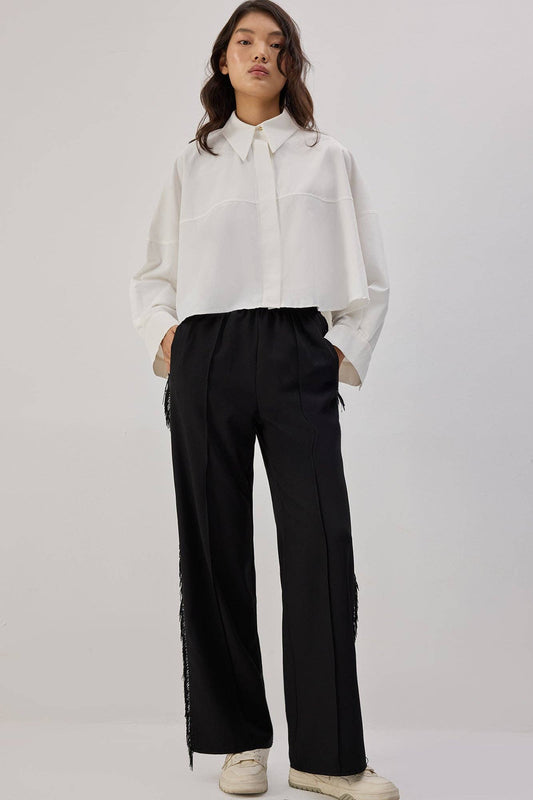 Pantaloni in crêpe con frange