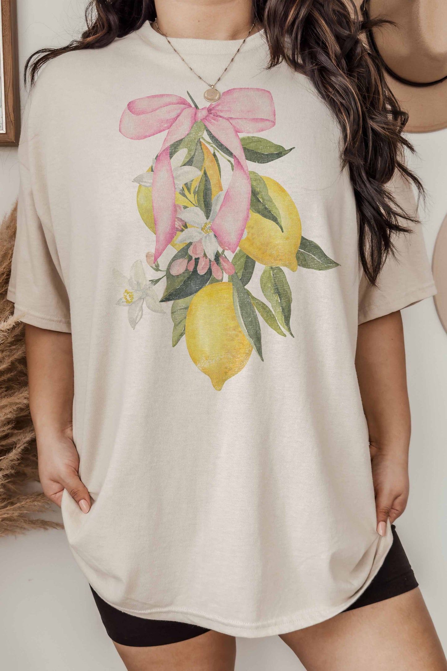 T-shirt oversize limone con fiocco rosa