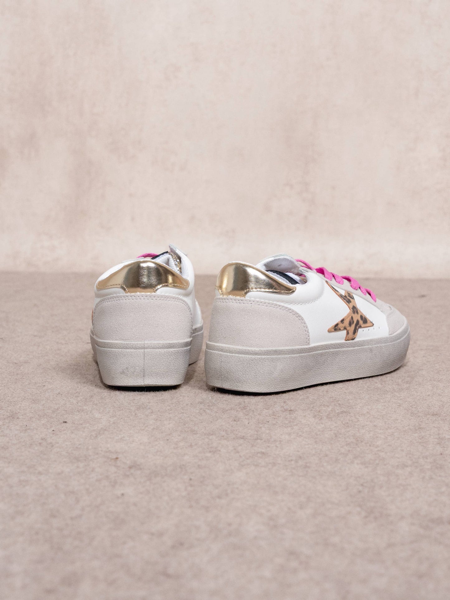Sneakers platform con stella animalier e glitter
