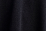 Top corto in maglia con frange sulle maniche