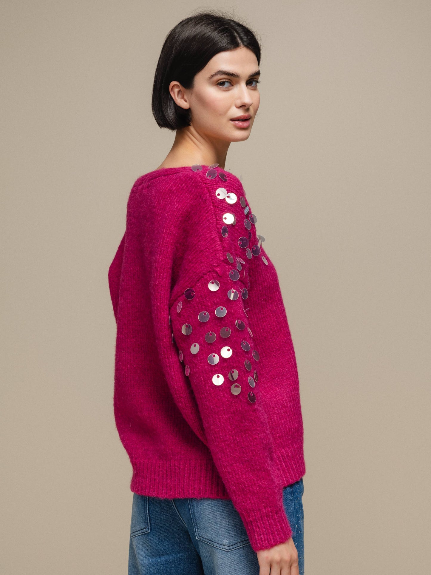 Maglione in maglia con paillettes sulle maniche