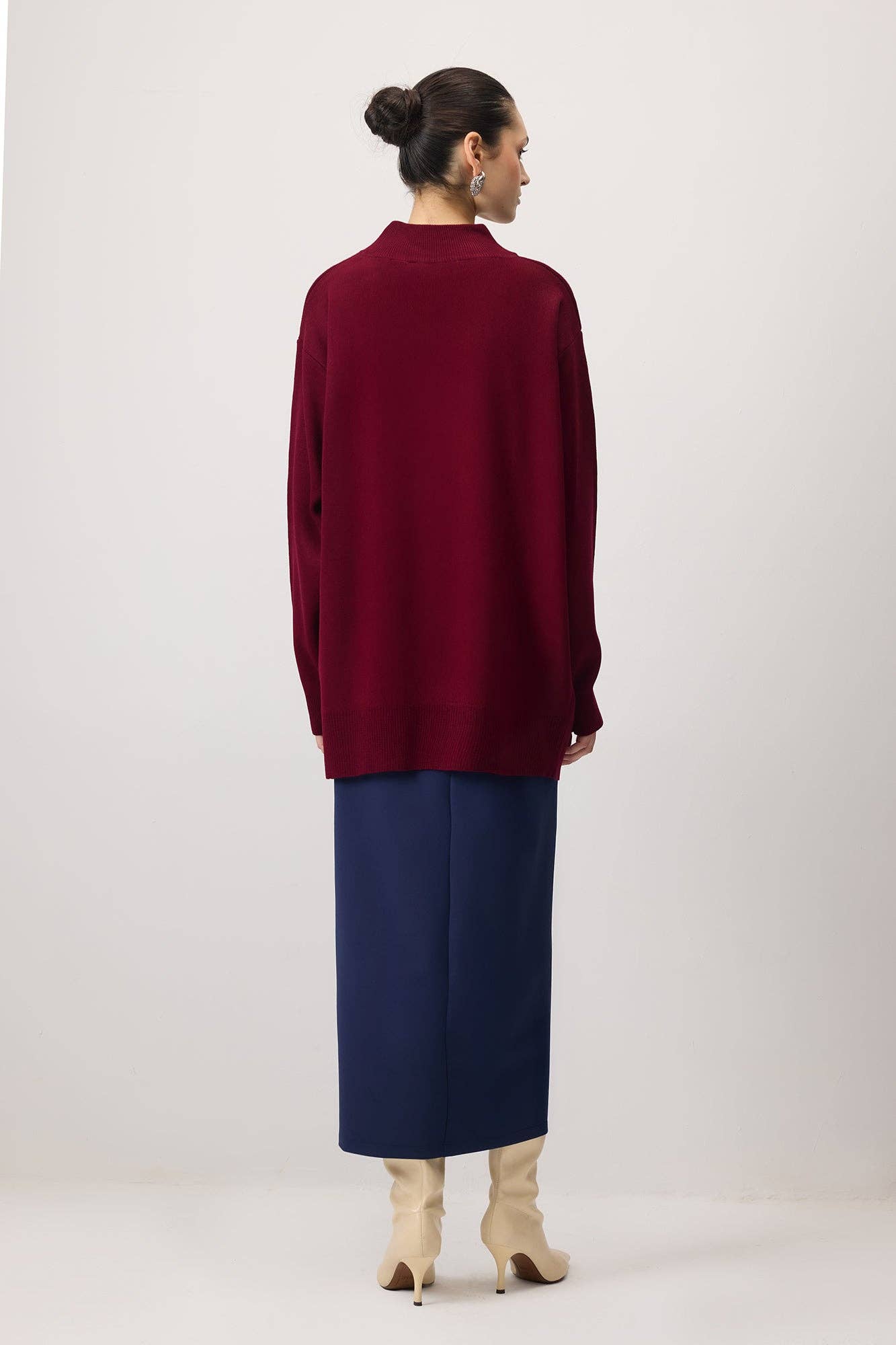 Tunica in maglia oversize con accessorio metallico