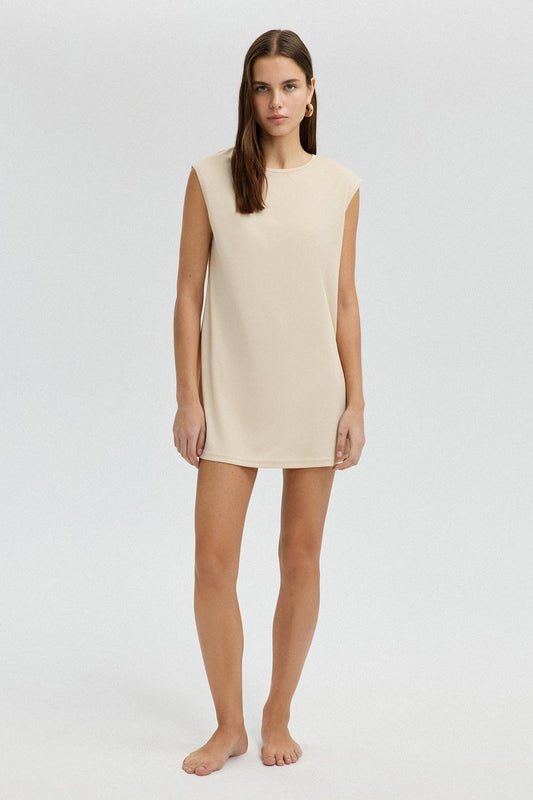Tunica lunga minimalista senza maniche color crema