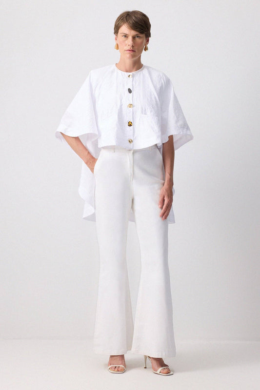 Poncho in cupro bianco con bottoni dorati