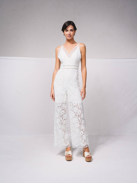 Tuta intera in pizzo con scollo a V e spalline incrociate