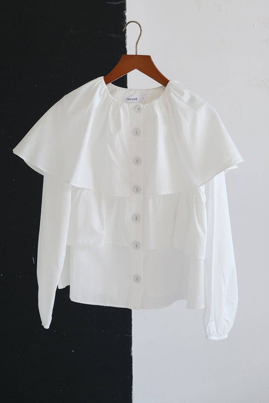 Blusa corta con balze e maniche a sbuffo in misto cotone