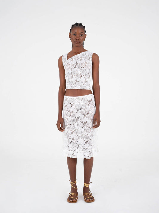 Top asimmetrico in pizzo bianco scintillante