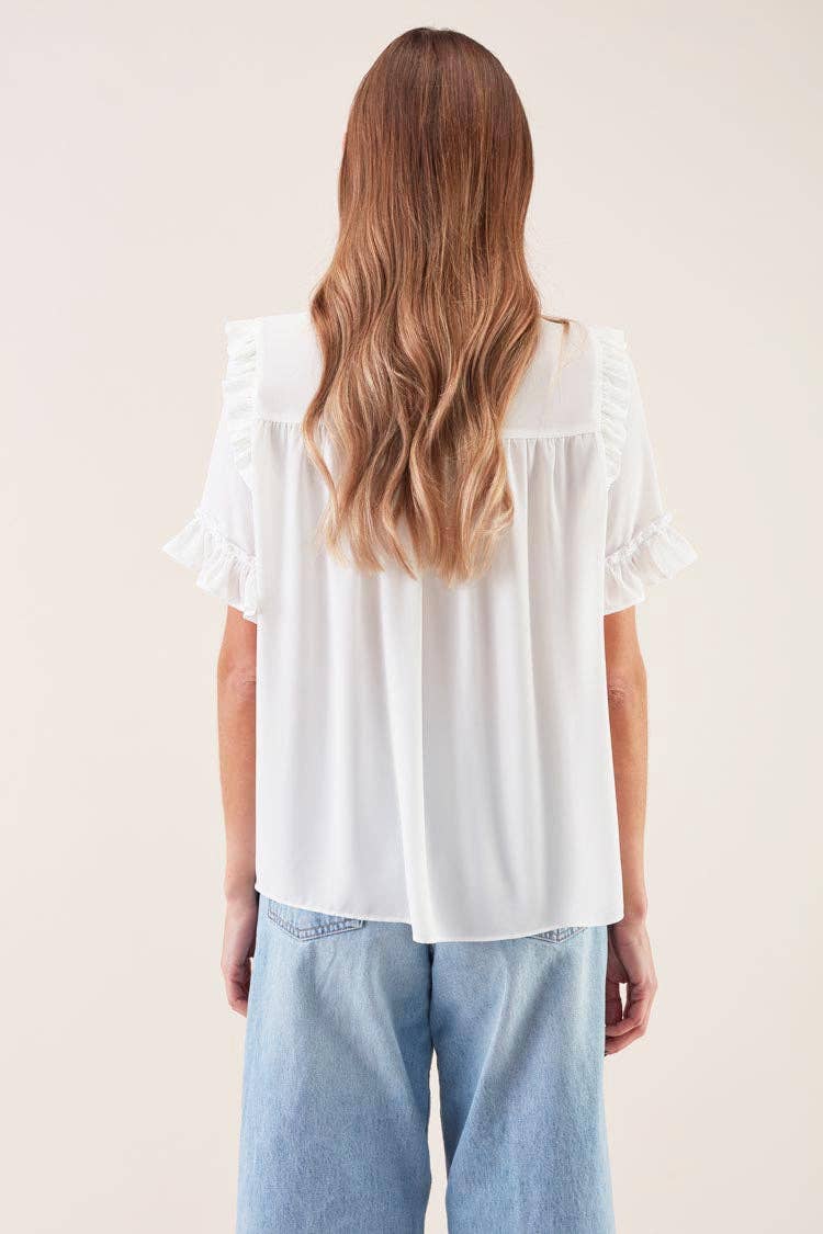 Blusa con fiocco e volant Lacada