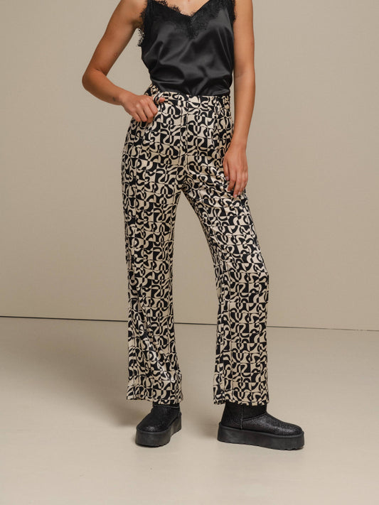 Pantaloni a fantasia geometriche effetto perlato