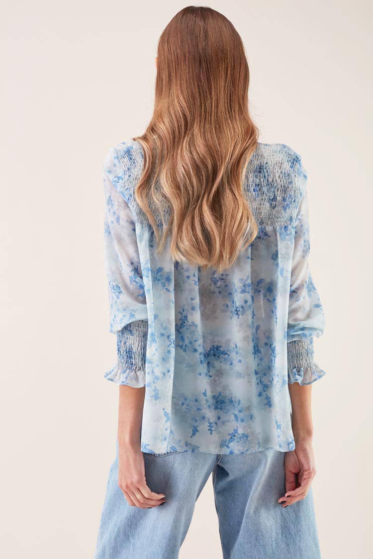 Blusa morbida con elastico e stampa azzurra