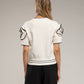 Top in maglia rasata con scollo rotondo e bordi a contrasto