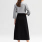 Gonna jeans a linea midi nera con bottoni