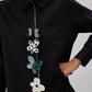Camicia in popeline nera con applicazioni floreali