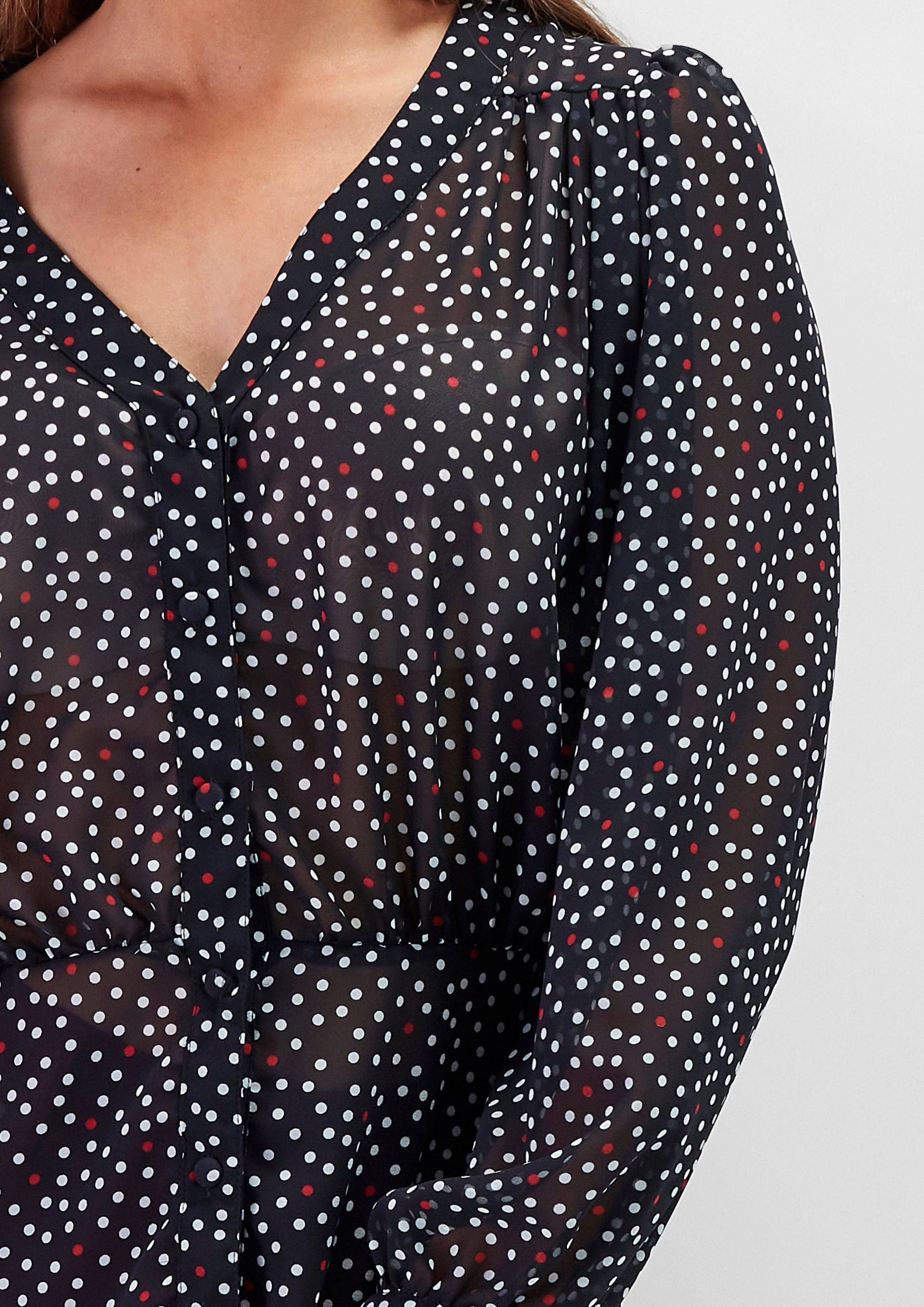 Blusa a pois con scollo a V e maniche morbide