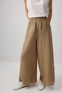 Pantaloni palazzo in cotone con bordi sfrangiati