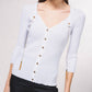 Cardigan in maglia a coste con catene dorate
