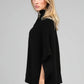 Poncho maglia nero a collo alto con bottoni