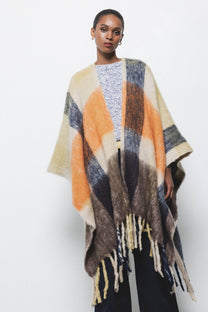 Poncho a quadri con frange
