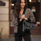 Cardigan animalier in maglia con bordi neri
