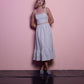 Abito midi in lurex con spalline e balza
