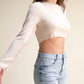 Top corto in maglia con frange sulle maniche