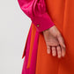 Abito lungo color block con fiocco laterale