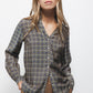 Blusa con motivo geometrico e scollo a V