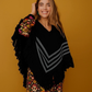 Poncho nero con scollo a V e frange