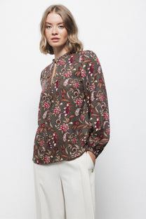 Blusa floreale con laccio al collo