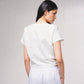 T-shirt crop con fiocco e applicazioni gioiello