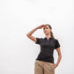 Polo donna nera in piqué antimacchia