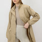 Giacca beige con colletto dritto e coulisse in vita