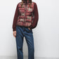 Gilet trapuntato con collo alto