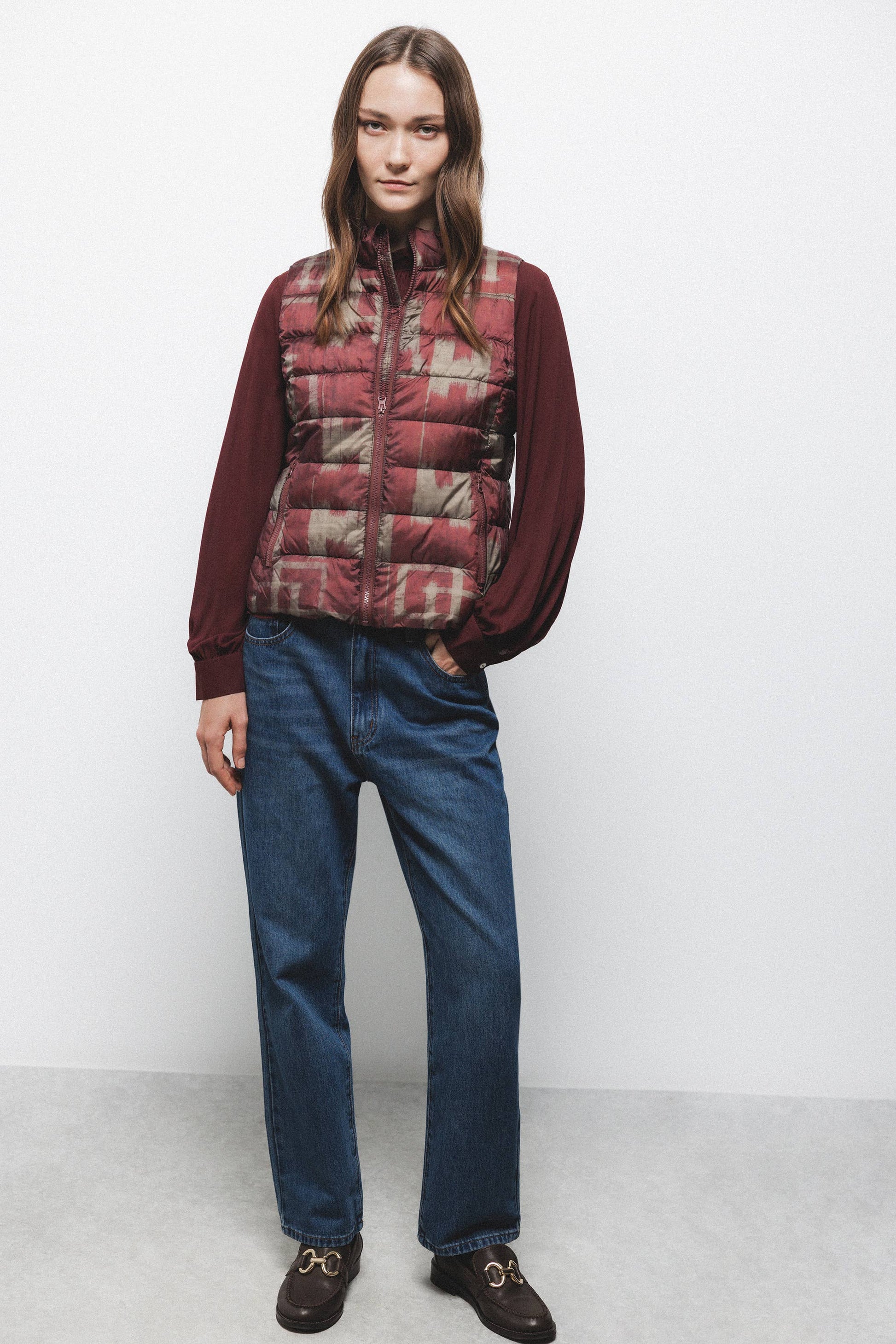 Gilet trapuntato con collo alto