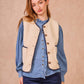 Gilet in ecopelliccia con profili intrecciati blu