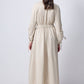 Abito midi beige con maniche arricciate e spilla in metallo