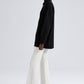 Maglione nero oversize con bottoni asimmetrici