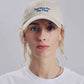 Cappellino beige con ricamo “Just Here For The Vibes”