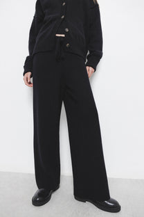 Pantaloni palazzo in maglia con vita elasticizzata