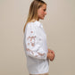 Blusa in cotone con maniche ricamate