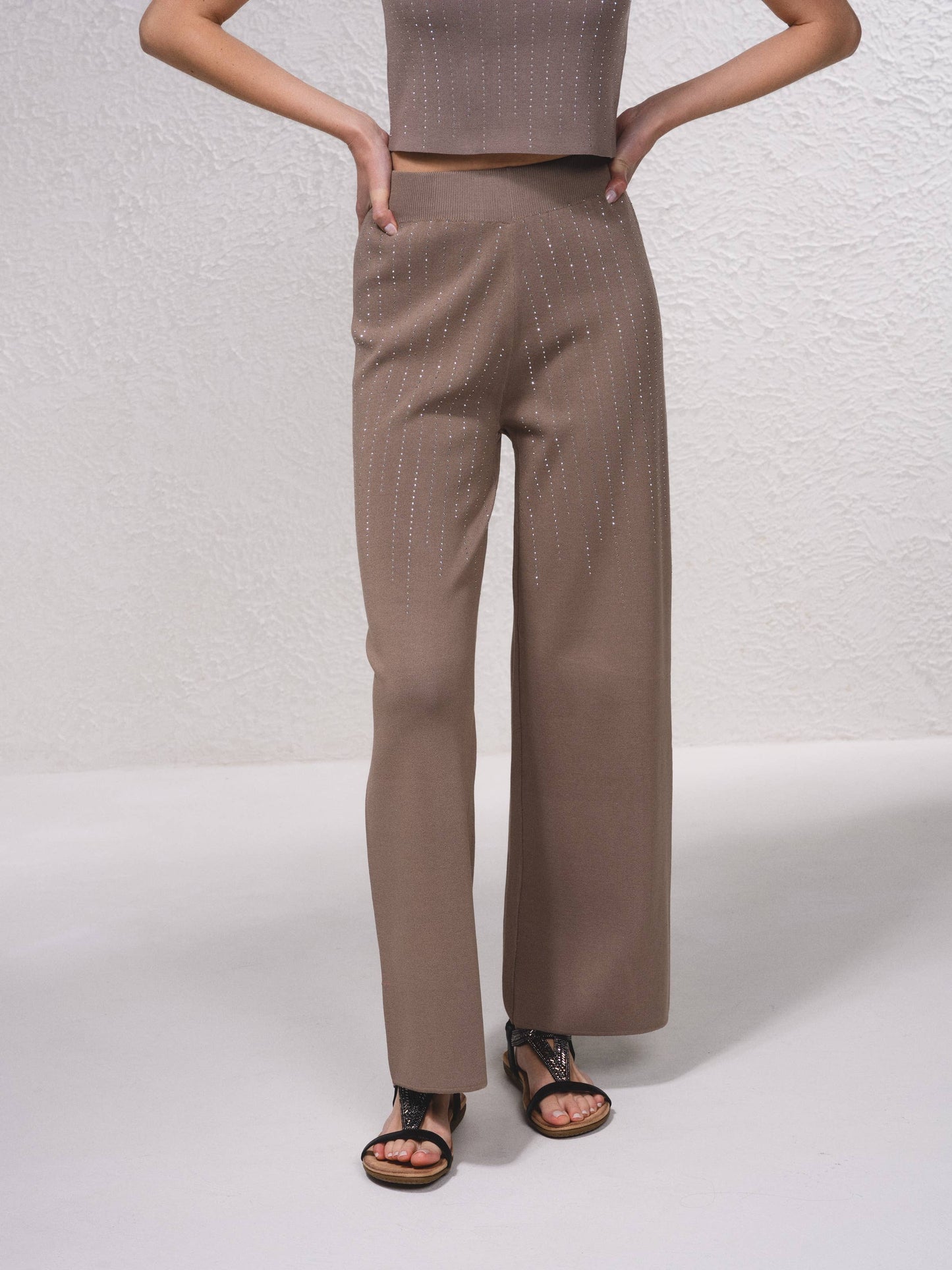 Pantaloni in maglia a gamba ampia con applicazioni glitter