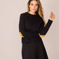 Maglione nero con toppe a cuore e bottoni sul retro