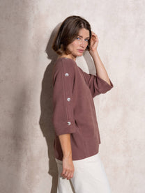 Maglia ampia in maglia con bottoni sulle maniche