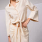 Blusa con nodo frontale e colletto a camicia