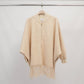 Poncho in maglia con frange e zip, maniche a pipistrello