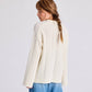 Maglione in lana d’agnello biologica a maniche lunghe con lavorazione drop needle
