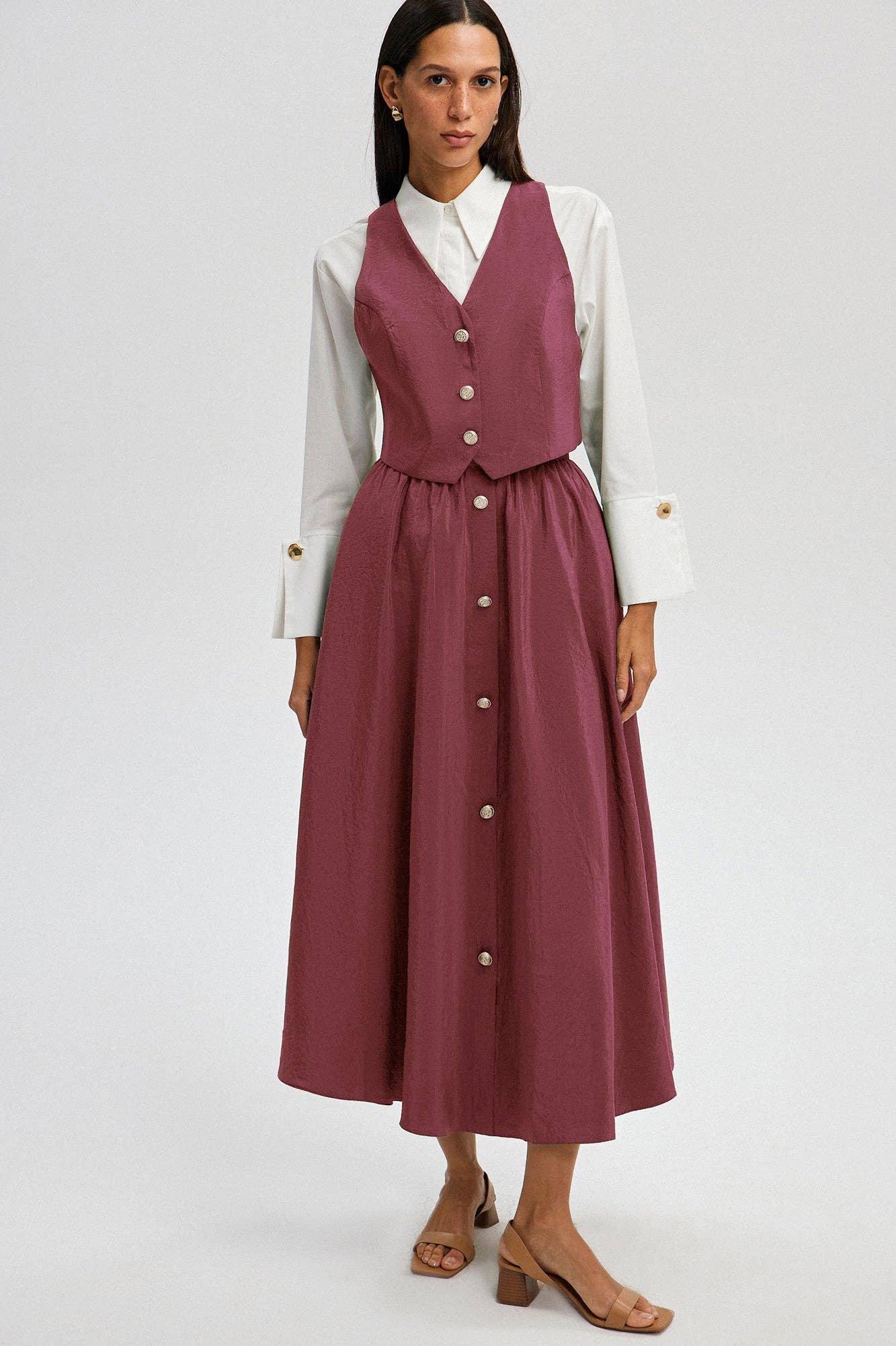 Set gilet e gonna midi in cupro rosa