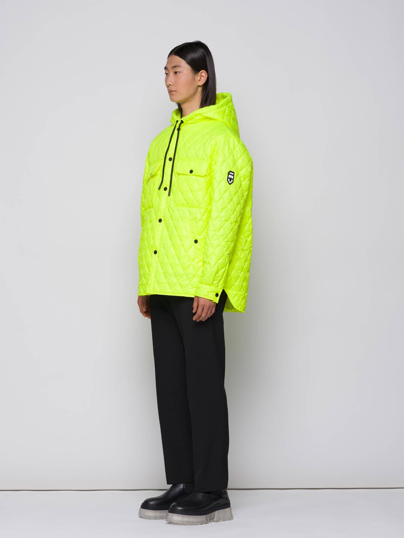 Giacca trapuntata a rombi con cappuccio fluo